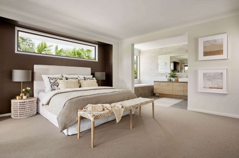 Bedroom with open ensuite and brown feature wall